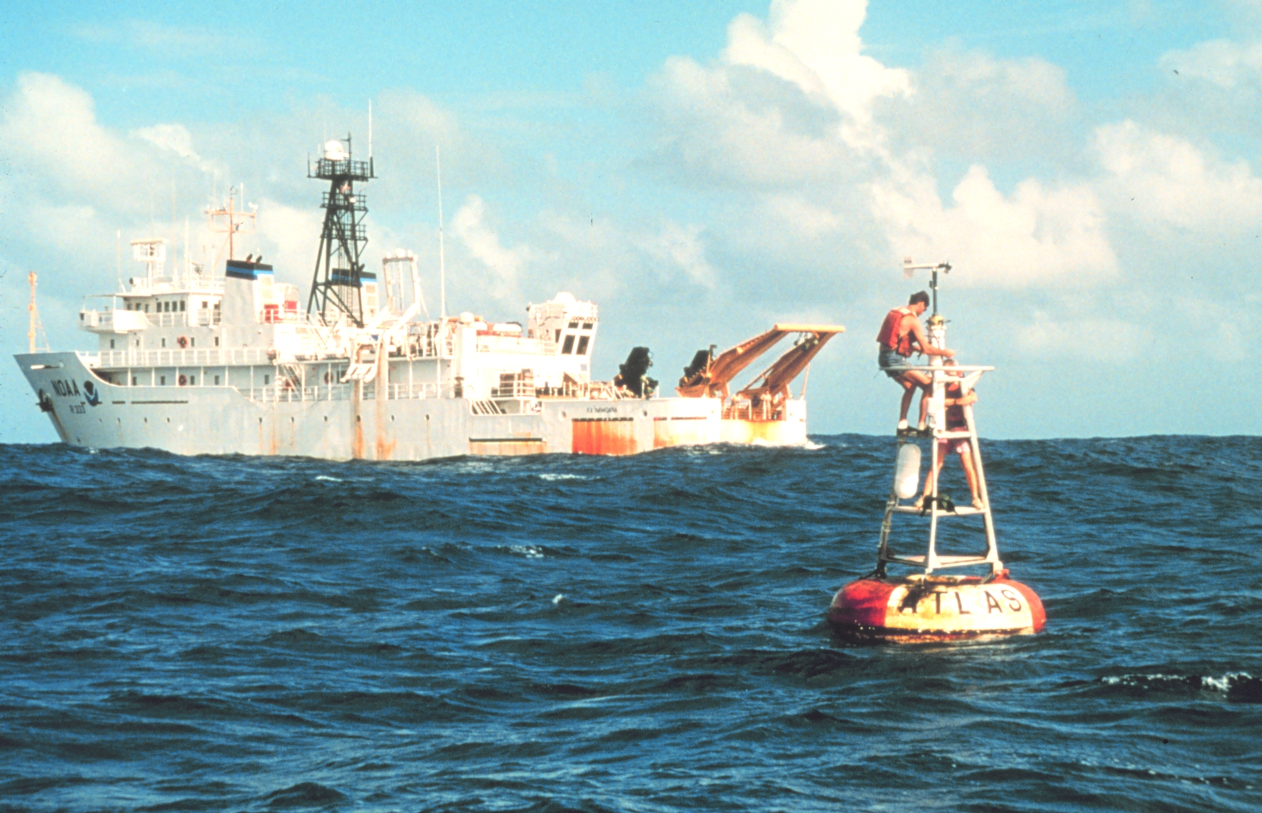 buoy near coast guard boat in open water